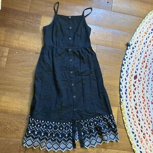 Medium black button tank dress with embroidered hem detail